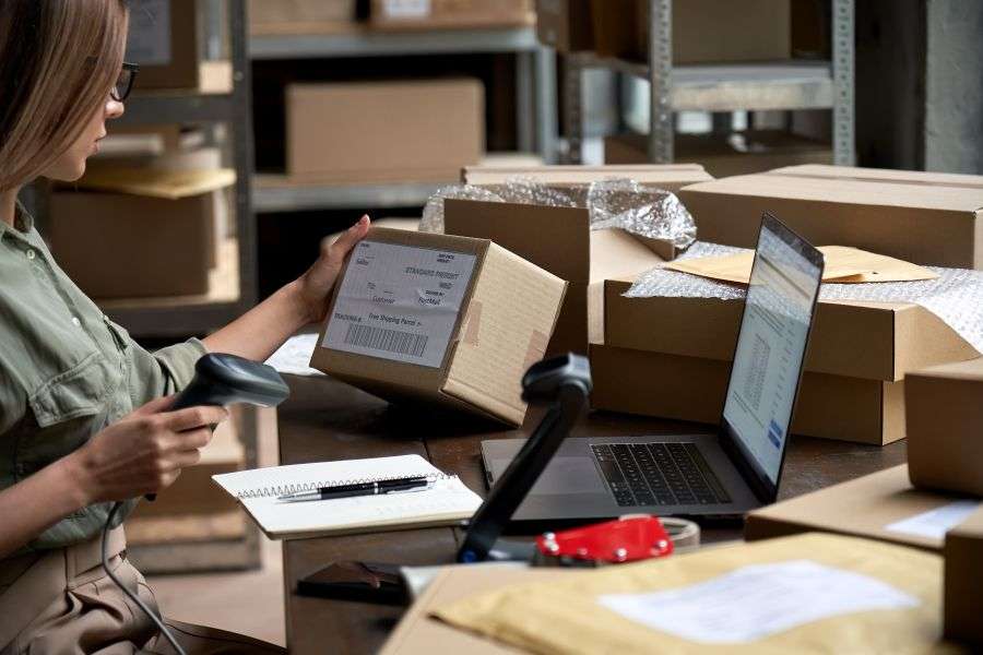 female seller scanning ecommerce shipping box in d 2021 09 02 07 22 46 utc result