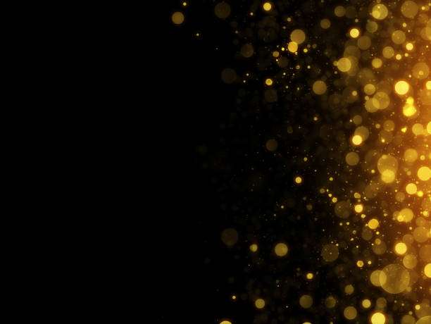 abstract-defocused-black-background-with-gold-particles