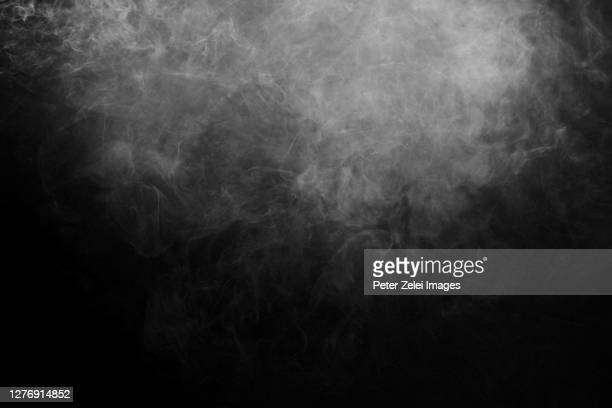 smoke-against-black-background-min
